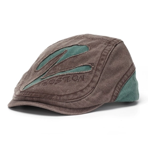 Detailed view of a washed distressed men's flat cap featuring Boston letter embroidery