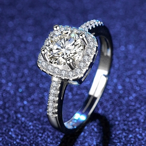 Macro detail of hexagonal halo ring with round center stone and pave diamond band