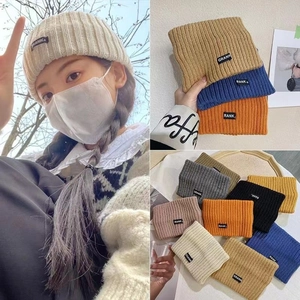 Versatile knitted sports headband with RANK label shown in various solid colors