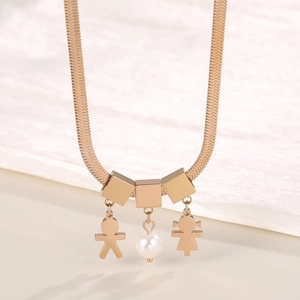Macro view of flat snake chain necklace with rose gold boy girl and pearl pendants