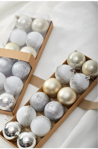 Detail view of 12-piece Christmas ball sets in silver and white with glitter patterns