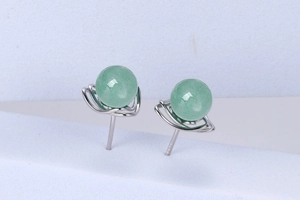 Macro shot of S925 silver earrings featuring double layered green aventurine gemstones