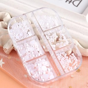Six-grid organizer box with various sizes of white flatback pearls for nail art and DIY