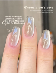 Macro shot of White Moonlight ceramic cat's eye nail gel with silver metallic magnetic effect