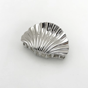 Polished silver shell-shaped metal hair claw clip with a reflective metallic finish