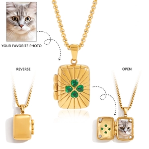 Detail of clover locket necklace showing magnetic closure and custom photo compartment