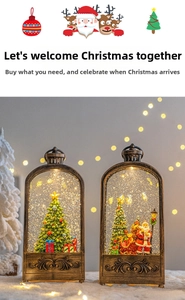 Close-up of vintage bronze Christmas snow globe lanterns with Santa and glitter snow
