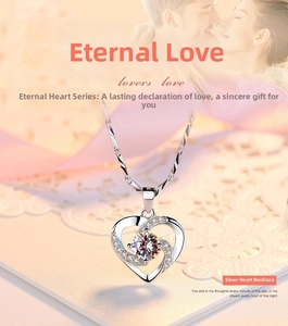 Detail of silver heart pendant with prong-set central cubic zirconia and twisted wave chain