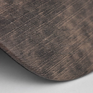 Detail of vintage washed canvas baseball cap brim with four rows of reinforced stitching