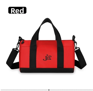 Detail view of red nylon bag with black JLP logo and detachable shoulder strap
