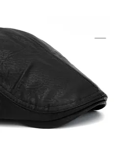 Close-up of black leather beret featuring wide brim with lychee texture and stitching
