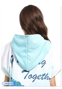 Detail of adult microfiber surf poncho featuring Together print and whale tail pattern