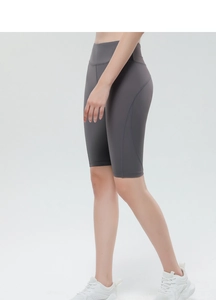 Detailed side view of high-waist dark grey yoga shorts with ergonomic curved stitching