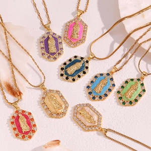 Detailed macro view of 18K gold-plated hexagonal Virgin Mary pendants with colorful enamel