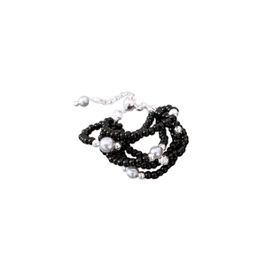 French vintage multilayer beaded bracelet with black and grey pearls on white background