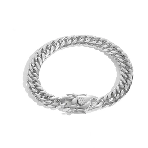 Macro shot of silver stainless steel Cuban link bracelet with unique dragon head clasp detail
