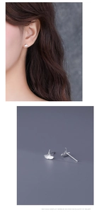Macro view and model shot of ginkgo leaf silver studs featuring mirror finish and detailed veins