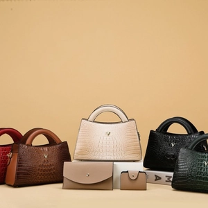 Three-piece women's handbag set featuring crocodile pattern in multiple elegant colors