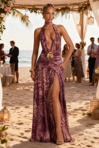 Detailed close-up of deep V-neckline and golden flower waist buckle on leopard maxi dress