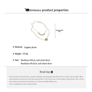 Macro detail of gold-plated double layer necklace with cubic zirconia pendant and specs