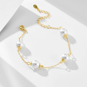 Elegant S925 sterling silver gold plated bracelet featuring four round white pearls