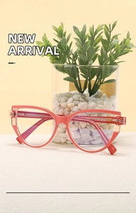 Macro shot of translucent pink cat-eye frame with metal core temples and size details