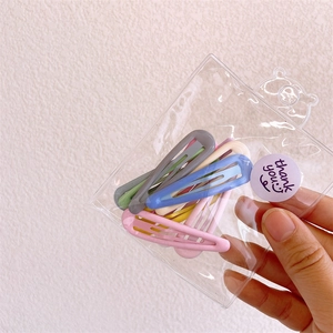 Mini candy-colored metal snap hair clips set for girls in clear plastic packaging