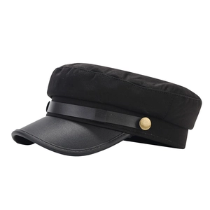 Classic black military fiddler hat with leather visor and decorative gold buttons