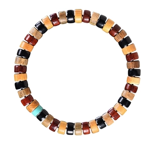 Colorful rectangular wooden bead bracelet with turquoise accent on a white background