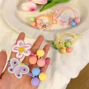 Cute floral and animal charm hair ties for girls in vibrant pastel colors and patterns