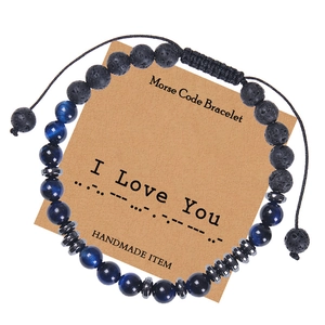 Detail of Morse code bracelet with blue tiger eye stones on I Love You gift card