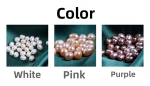 Close-up of white, pink, and purple freshwater rice pearls on dark green silk fabric