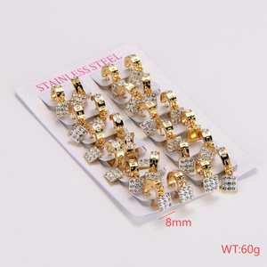 Detailed view of gold stainless steel hoop earrings with white zircon on display