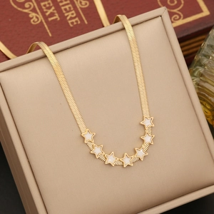 Detail of gold herringbone chain with seven star pendants and white shell inlays