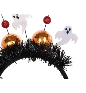 Detail of Halloween headband with white ghosts and sparkling orange and red spheres