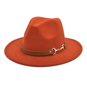 Classic rust orange wool fedora hat with wide brim and decorative leather horsebit buckle band