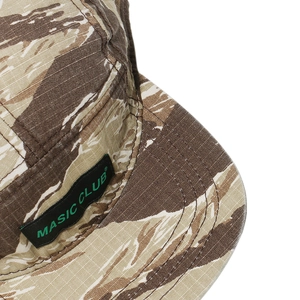 Detail of tiger camo pattern on ripstop fabric with Masic Club woven label