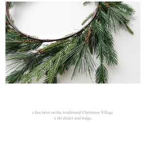 Close-up of Nordic Christmas wreath showing green pine needles and brown vine base