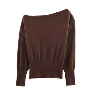 Detail of off-shoulder long sleeve knit sweater in brown with ribbed cuffs and hem