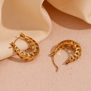 Detailed close-up of 18K gold-plated U-shaped earrings with hollow heart pattern