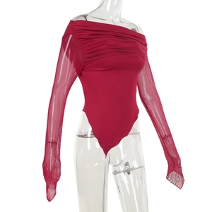 Detail view of burgundy bodysuit featuring mesh sleeves and elegant ruched chest design