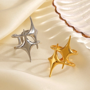 Minimalist 18K gold and silver plated stainless steel star-shaped rings on silk