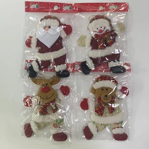 Detail view of 4-piece Christmas doll set including Santa, Snowman, Deer and Bear