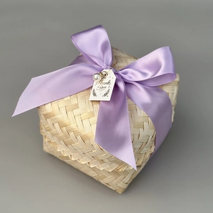 Detailed shot of bamboo gift box with purple silk ribbon and Thank You tag decor