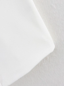 Detailed macro view of white twill fabric texture for single-breasted blazer