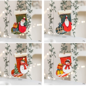 Detail view of 13.5cm wooden Christmas stocking ornaments with painted Santa and snowman