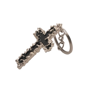 European style silver metal cross keychain with black enamel and lava texture finish