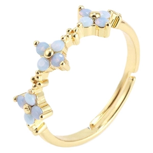 Adjustable golden open ring with three white faux opal clover patterns on a white background