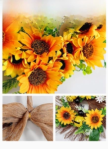 Detail display of sunflower wreath showing silk petals and burlap bow texture