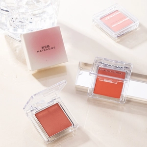 Elegant MEIBAOGE matte powder blush set with single color shades on natural stone background